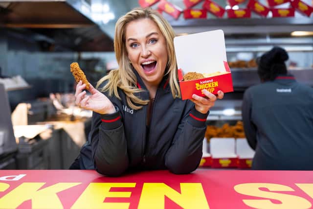 Josie Gibson behind the counter at the Iceland Chicken Shop in Fulham.