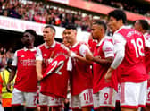 Arsenal's Gabriel Martinelli (centre) holds up former team-mate Pablo Mari's shirt as he celebrates scoring their side's first goal of the game during the Premier League match at the Emirates Stadium,