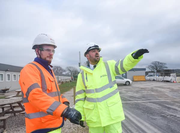 Transport minister Richard Holden (right) with contractor representative Luke Presho at the A585 Windy Harbour to Skippool site