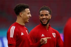 Ethan Ampadu and Tyler Roberts of Wales speak during their taining session ahead of the UEFA Euro 2020 Round of 16 match against Denmark at Johan Cruijff Arena on June 25, 2021 in Amsterdam, Netherlands. (Photo by Dean Mouhtaropoulos/Getty Images)