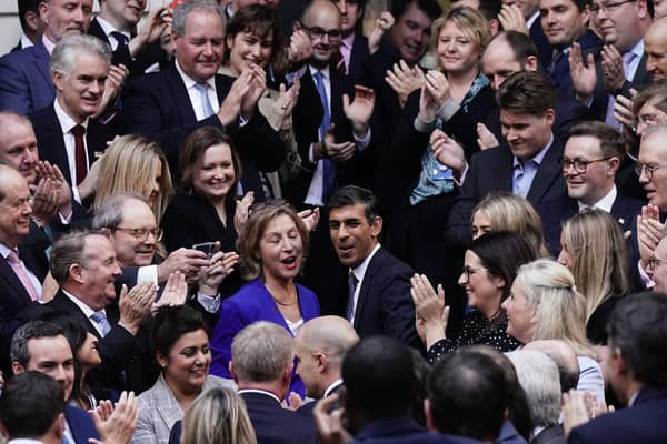 Rishi Sunak is congratulated as he arrives at Conservative party HQ in Westminster, London, after it was announced he will become the new leader of the Conservative party after rival Penny Mordaunt dropped out.