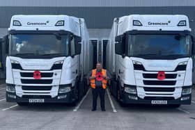 Greencore lorries with colleague