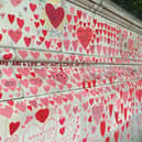 London’s Covid Memorial Wall: A Heartfelt Tribute Lit with Festive Lights