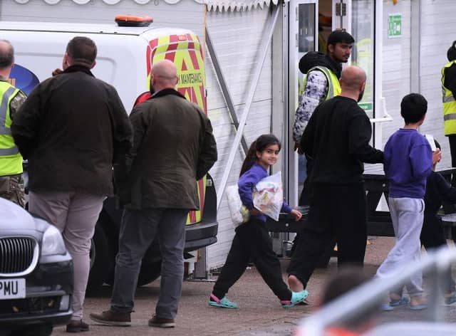 Detainees are seen inside the Manston holding centre for asylum seekers. Immigration minister Robert Jenrick this week vowed "more radical" policies to counter illegal migration.