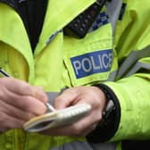 File photo dated 22/10/14 of a police officer making notes. Shop owners have asked the Home Secretary to specifically outlaw attacks on retail workers. The Government should create a new offence of assaulting, threatening or abusing a retail worker, dozens of business leaders said.