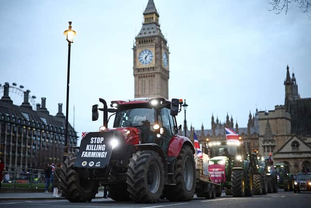 Farmers drive tractors around Parliament Square during a demonstration organised by Save British Farming against UK food policy, substandard imports and stricter food labelling regulations.