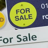 General view of estate agents signs outside a block of flats in Basingstoke, Hampshire.