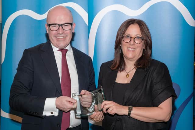 Bronwen accepting a Best in Everyone award from Sir Jon Coles, CEO of United Learning.