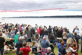 The Red Arrows dazzle spectators with their diamond nine aerobatic display across the shores of Belfast Lough