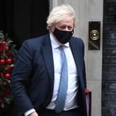 Boris Johnson leaves Downing Street to attend Prime Minister's Questions on December 7, 2021 in London, England. The prime minister faced questions in parliament about a Christmas party that allegedly took place inside 10 Downing Street last December. (Photo by Chris J Ratcliffe/Getty Images)