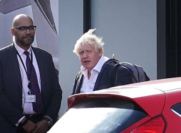Former Prime Minister Boris Johnson arrives at Gatwick Airport in London, after travelling on a flight from the Caribbean, following the resignation of Liz Truss as Prime Minister. Picture date: Saturday October 22, 2022.