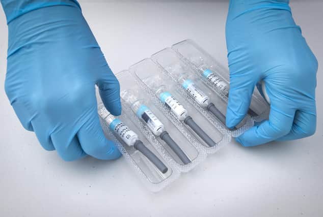 File photo dated 26/09/2020 of a nurse preparing flu vaccine jabs. People are being urged to get their flu jabs to help relieve pressure on the NHS ahead of winter.