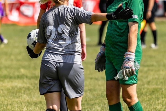 Paula playing football.