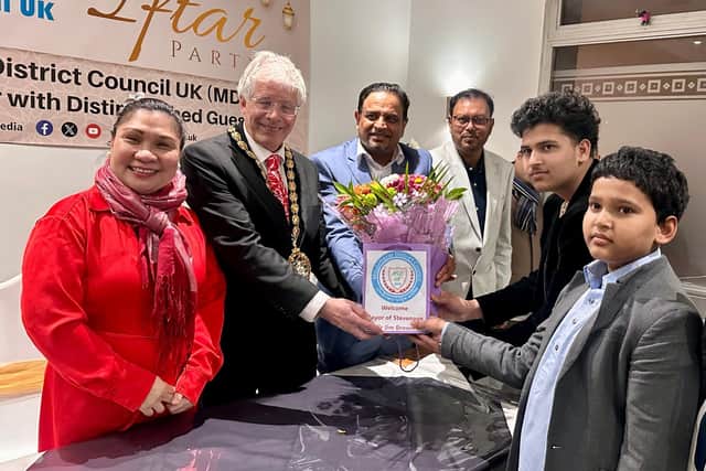 Presenting flowers to Mayor of Stevenage Cllr Jim Brown by Oli Khan MBE President MDC
