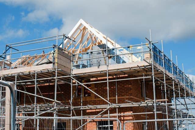 Loading platform made of scaffold system on housing development construction site.