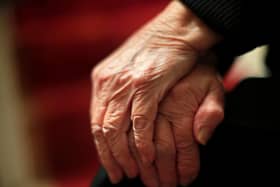 The hands of an elderly woman in Poole, Dorset. 