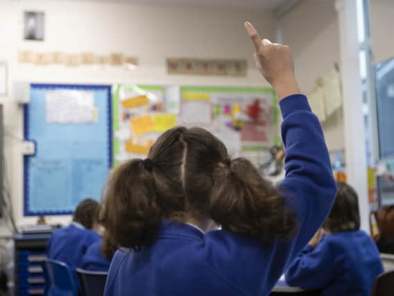 File photo dated 27/11/19 of school children during a class at a primary school, as teaching assistants are taking second jobs or leaving education to work in better-paid roles amid cost-of-living pressures, a report by The National Foundation for Educational Research suggests.