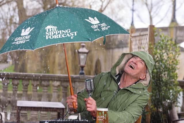 Larry Lamb battling the rain, delivering The Sipping Forecast to help the country navigate unpredictable pub-garden weather this spring.