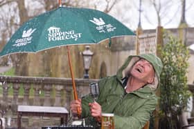 Larry Lamb battling the rain, delivering The Sipping Forecast to help the country navigate unpredictable pub-garden weather this spring.