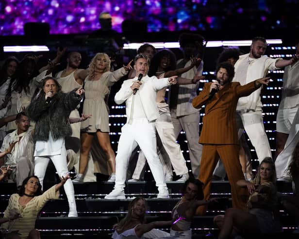 (left to right) Mark Owen, Gary Barlow and Howard Donald from Take That will be touring the country next year.