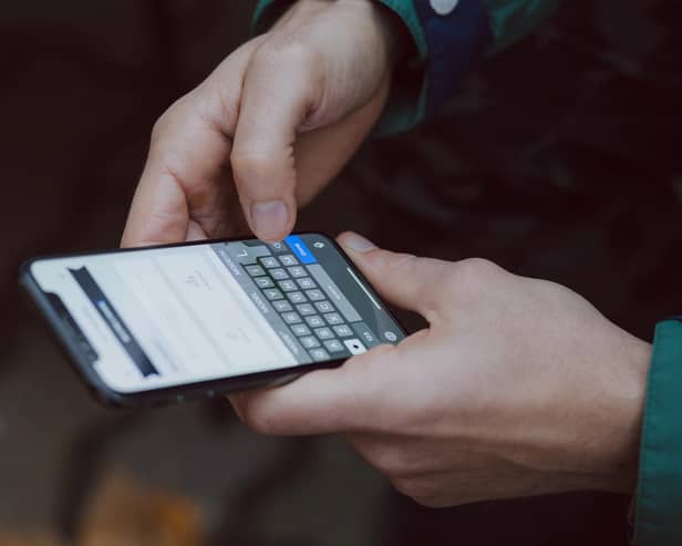A person holding a mobile phone. Picture: Unsplash.