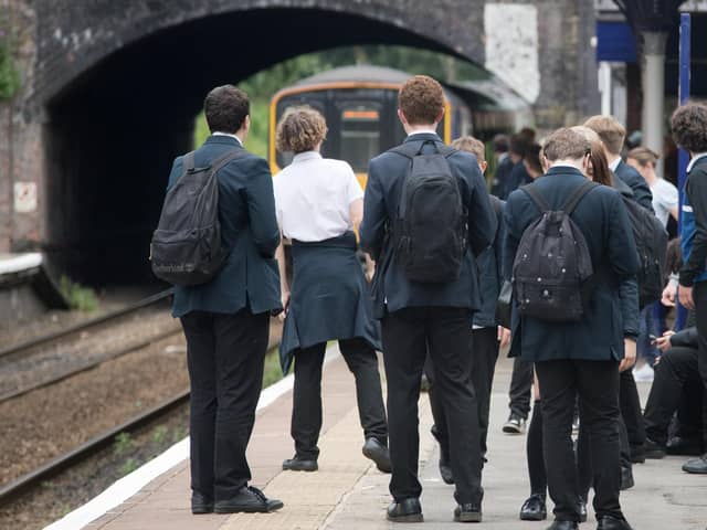 Schoolchildren awaiting the arrival of a Northern service.