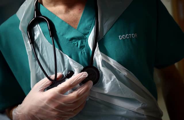 EMBARGOED TO 0001 TUESDAY JUNE 13 File photo dated 17/05/20 of a junior doctor holding his stethoscope at The Royal Blackburn Teaching Hospital in East Lancashire. The NHS will face "enormous" disruption as junior doctors in England go out on strike later this week, a top doctor has warned. Almost all routine or pre-planned care could be impacted in some way, according to Professor Sir Stephen Powis, NHS England's national medical director. Issue date: Tuesday June 13, 2023.