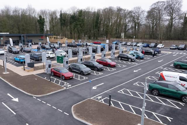 The site features 44 ultra-rapid EV chargers, a café, children’s play park, dog walking area, and 24/7 toilet facilities.