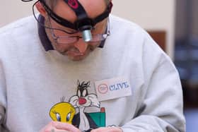 Clive Smith, member of the Gravesham Repair Café busy at work