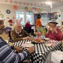 Residents Margaret, Valerie, Albert and Sally at HC-One’s Capwell Grange Care Home enjoying their Mad Hatter’s themed tea party in celebration of National Tea Party Day