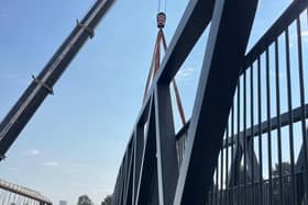 The bridge being lowered into place, linking the new homes at the development to Bevan’s Park