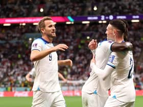 Bukayo Saka celebrates with Harry Kane and Phil Foden after scoring England's third goal against Senegal (Photo by Catherine Ivill/Getty Images)