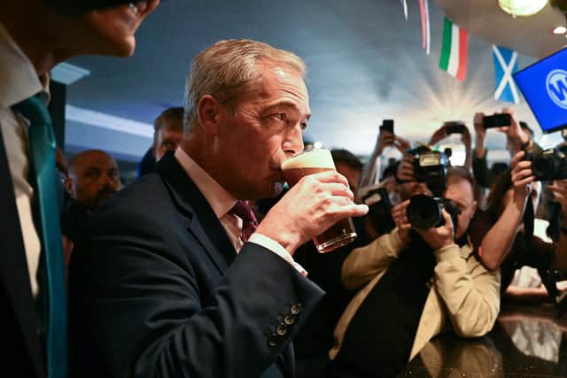 Reform leader Nigel Farage poses with a pint of beer in a Wetherspoons pub in Clacton-on-Sea (Picture: Ben Stansall/AFP via Getty Images)