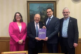 Dr William Bodel (second from right) presents Lord Hunt, Minister for Energy Security and Net Zero, with the Dalton Nuclear Institute policy paper from which his article is sourced, alongside University of Manchester colleagues Professor Zara Hodgson and Professor Adrian Bull