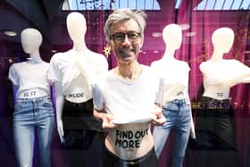 Kidney donor, John Burns, stands in a shop window at Bluewater Shopping Centre in Kent