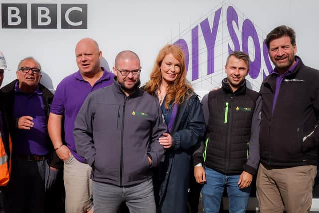 Liam Richards (third from left) and Michael Cummins (second from right) with the DIY SOS team