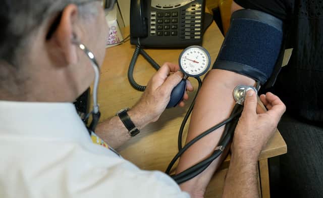 EMBARGOED TO 0001 MONDAY JANUARY 2, 2023 File photo dated 10/09/14 of a GP using a stethoscope. Some sick people are resorting to do-it-yourself medical treatment because they cannot get a face-to-face appointment with a family doctor, according to new research. A survey by Savanta ComRes found that, in the past 12 months, more than one in four adults had tried to get an in-person consultation with a GP in their local area but were unable to do so. Issue date: Monday January 2, 2023.