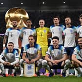 England players pose for a squad photo ahead of their Group B clash with Wales - with a 3-0 victory in the game setting up a last-16 tie with Senegal. (Photo by PAUL ELLIS/AFP via Getty Images)