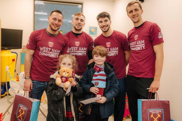 West Ham players were on hand to pass out gifts and spread Christmas cheer.