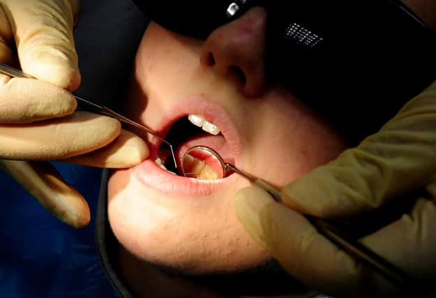 File photo dated 19/05/11 of a dentist at work. Millions of children in England were not seen by an NHS dentist last year, new figures show. Data obtained by the Liberal Democrats show that 4.4 million children in England were not seen by an NHS dentist in the year to June 2023. Issue date: Tuesday September 19, 2023.