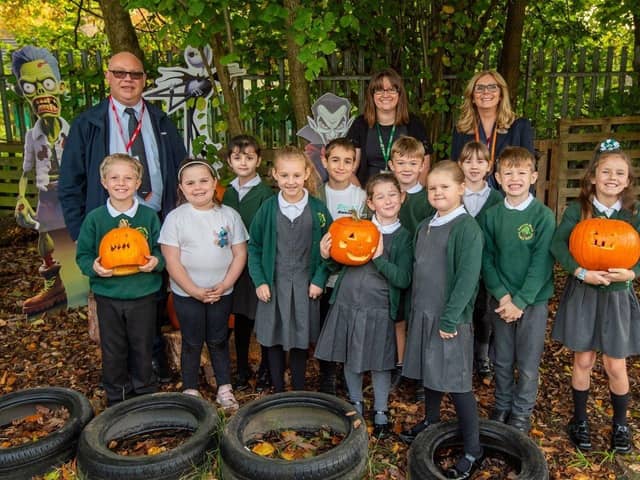 Children from Senacre Wood Primary showing off their pumpkins
