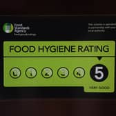 A Food Standards Agency rating sticker on a window of a restaurant in central London. A huge variation in food hygiene standards remains across the UK, with one in five high or medium-risk food outlets failing to meet standards, according to a study.