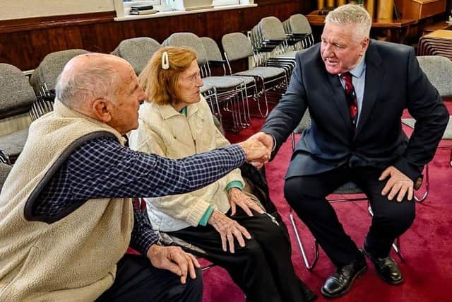 Alfie Buckland chatting with a carer.