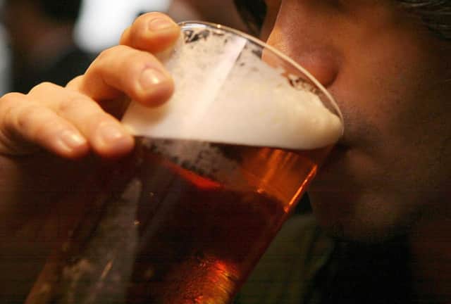 EMBARGOED TO 0505 WEDNESDAY DECEMBER 7 File photo dated 01/12/06 of a man drinking a pint of beer. For the first time in Europe, scientists have discovered the ancestor of the yeast species necessary for the production of lager beer. Issue date: Wednesday December 7, 2022.