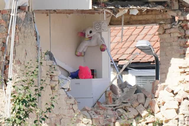 Soft toys and a lampost are seen in an exposed room of a property in Galpin's Road in Thornton Heath, south London, where a house collapsed amid a fire and explosion. A four-year-old girl is feared missing after a terraced home collapsed following an explosion, according to neighbours. Picture date: Monday August 8, 2022.