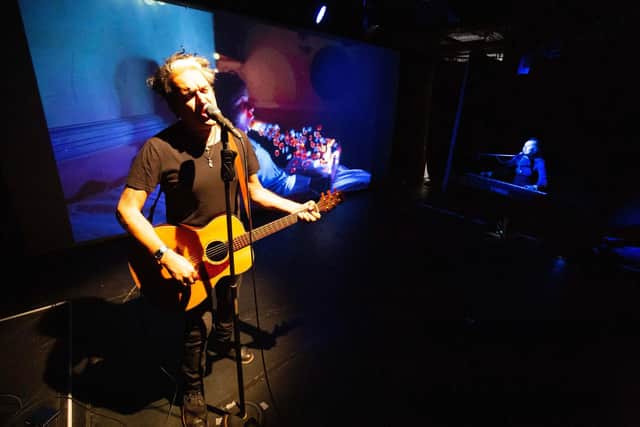 Tim Arnold performing Super Connected — the acclaimed indie rock opera combining live concert and film drama