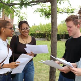 The John Roan School students celebrate after receiving their results.