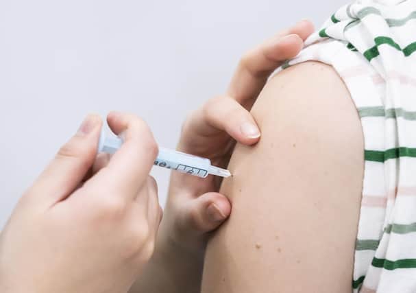 File photo dated 21/12/21 of a booster coronavirus vaccine being administered, as the NHS has visited every care home in England to deliver coronavirus booster and flu jabs, it has said.