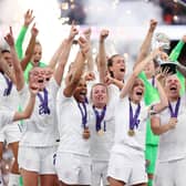 Leah Williamson and Millie Bright of England lift the trophy after their teams victory during the UEFA Women's Euro 2022 final match between England and Germany at Wembley Stadium on July 31, 2022 in London, England. (Photo by Naomi Baker/Getty Images)