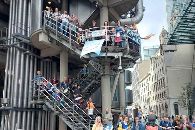 Extinction Rebellion protesters blockade the Lloyd’s of London building on Tuesday, April 12, as part of widescale climate crisis protests in the capital